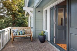 Entrance porch decorated with antique bench