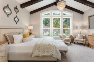 furnished master bedroom interior in luxury home