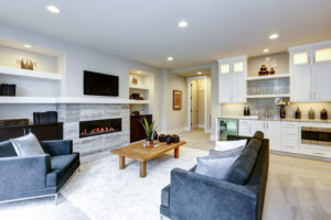 modern living room interior with stone wall and fireplace in luxury home