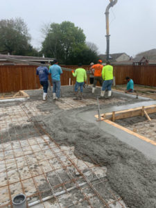 construction workers building house foundation